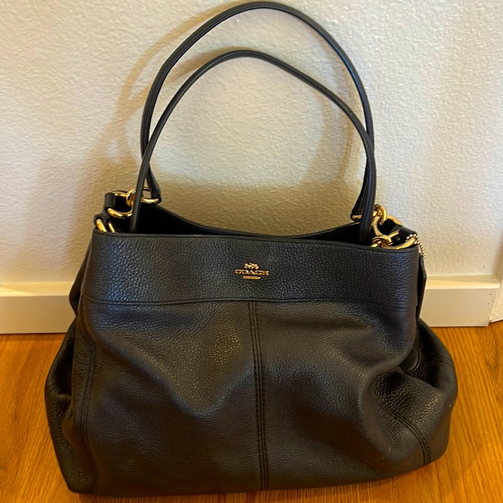 Black leather COACH purse with gold accents